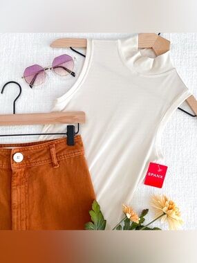 SPANX sleeveless mockneck bodysuit.
